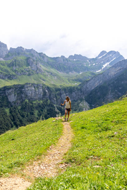 istock Woman Hiking on Mountain Path with Stunning Views 2165901461