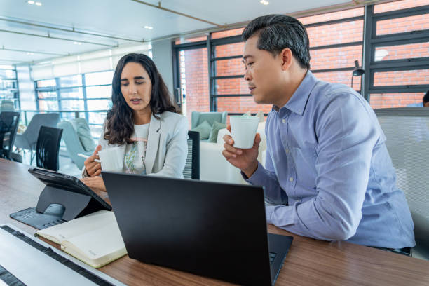 istock Two diverse businesspeople showing a balance between work and relaxation emphasizing the value of employee engagement and a positive corporate culture in fostering creativity and professional business. 2165906898