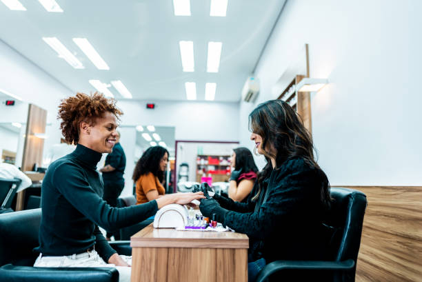 istock Manicure doing gay customer's nail on a nail salon 2165907109