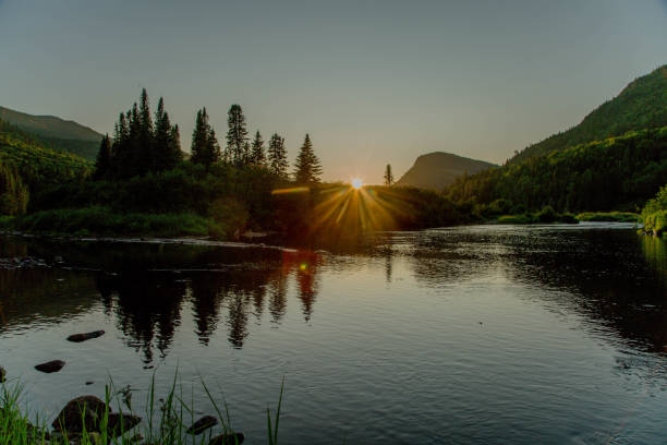 istock Beautiful Sunrise Scenery In A Canadian Forest Setting With a River 2165909801