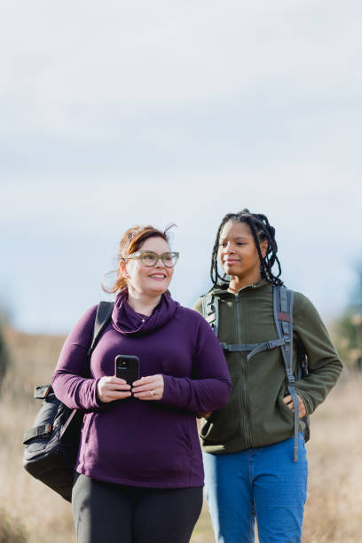 istock Multi Racial Mom and Daughter Winter Hike Together 2165910023
