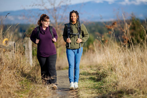 istock Multi Racial Mom and Daughter Winter Hike Together 2165910048