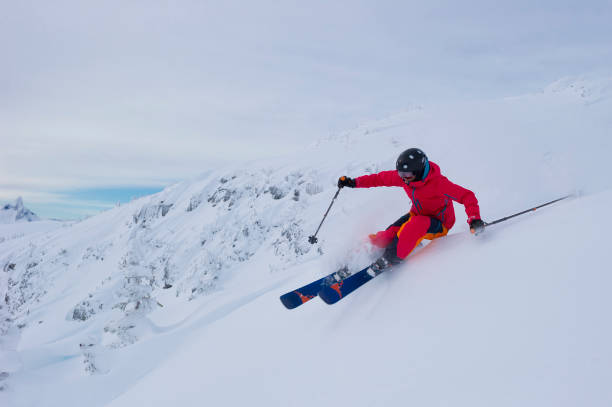 istock Woman skis fresh powder snow 2165911086