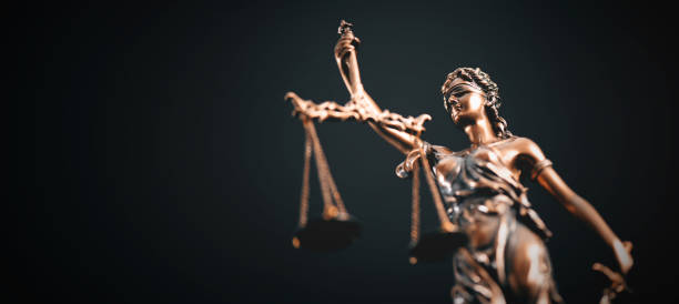 istock Lady Justice statue in law on blue background 2165914041