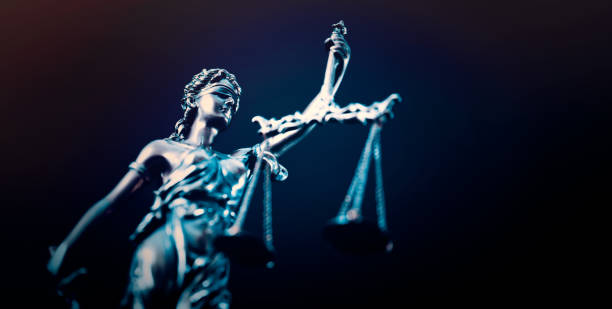 istock Lady Justice statue in law on blue background 2165914046