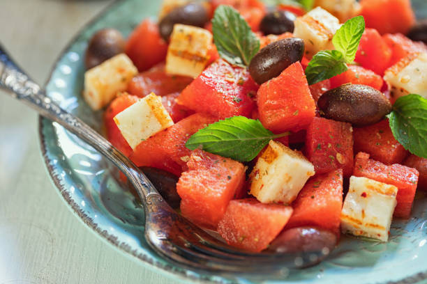 Watermelon salad with grilled halloumi cheese on a plate