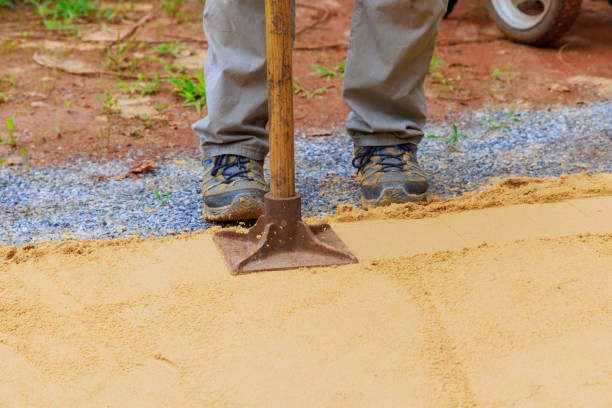 istock Sand tamping with worker uses a manual rammer 2165926175