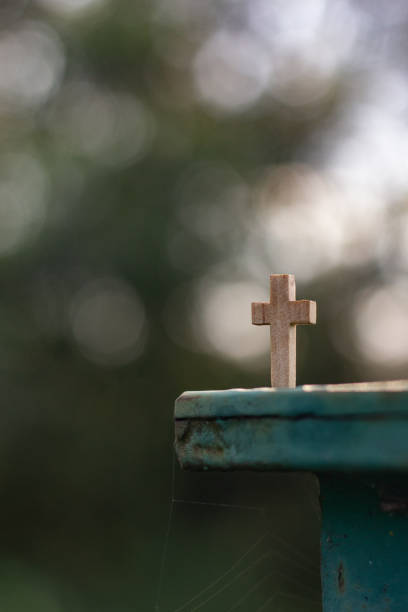 Wooden Christian cross with bokeh