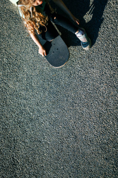 Low Section Of Men On Skateboards