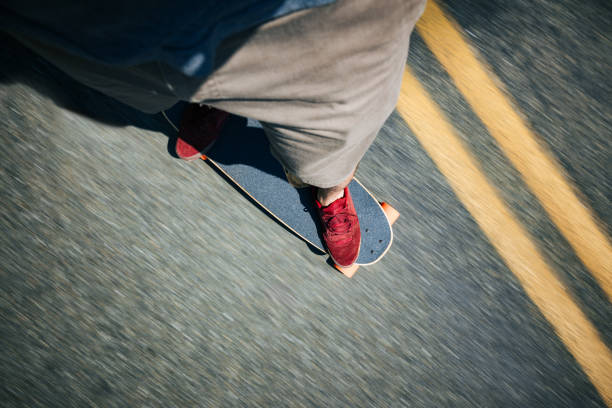 istock Person Riding Longboard 2165931581