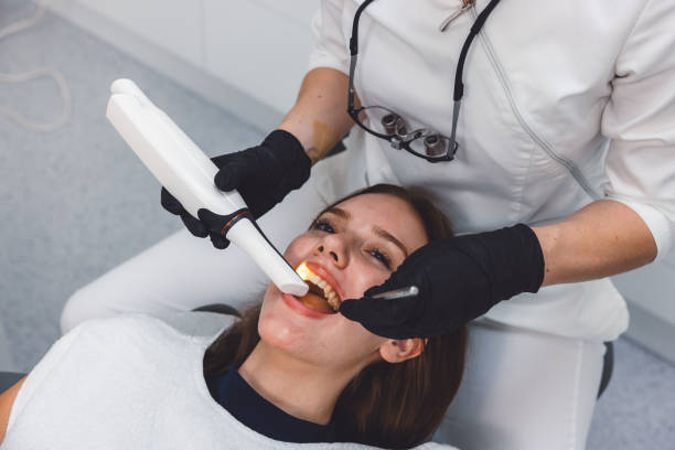 istock Dentist scanning patients teeth with x ray 2165936317