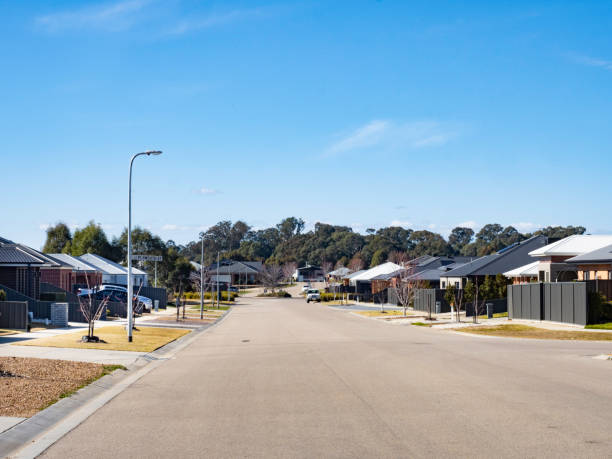 istock Wide street in new housing development 2165936420