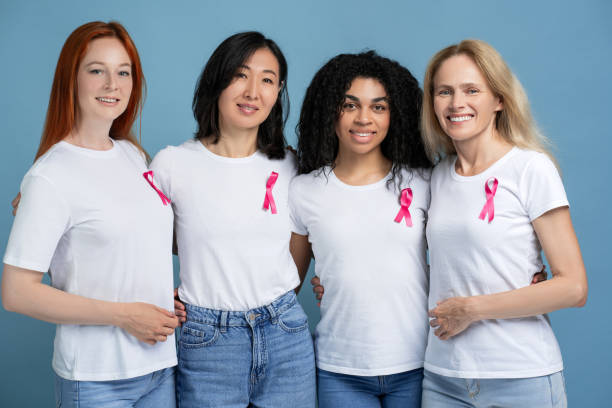 istock Multinational diverse women embracing showing support for breast cancer awareness looking at camera 2165937210