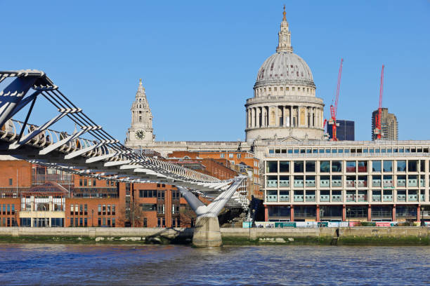 Daytime view of St. Paul's Cathedral and the Millenium bridge (London, England).