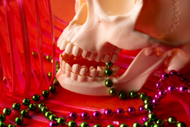 White skull and colorful festival stuff for day of the dead, and orange color background