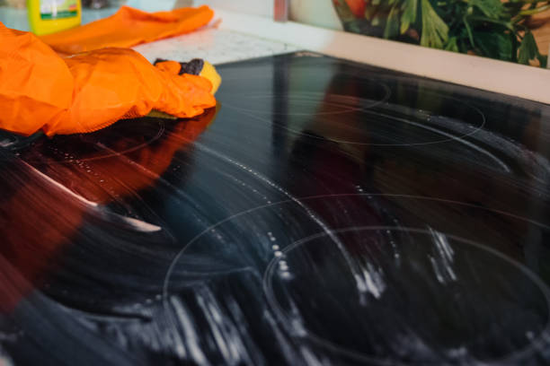 istock Washing the cooktop with a sponge and detergent 2165943987