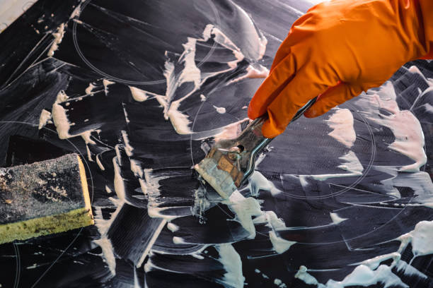 istock Orange glove, metal scraper, sponge and foam cleaner 2165943993