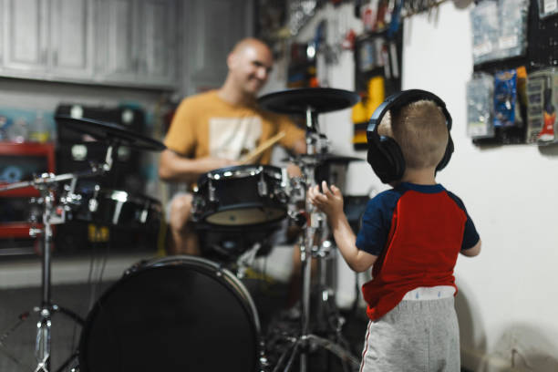 istock A father teaching his son to play the drums 2165944140