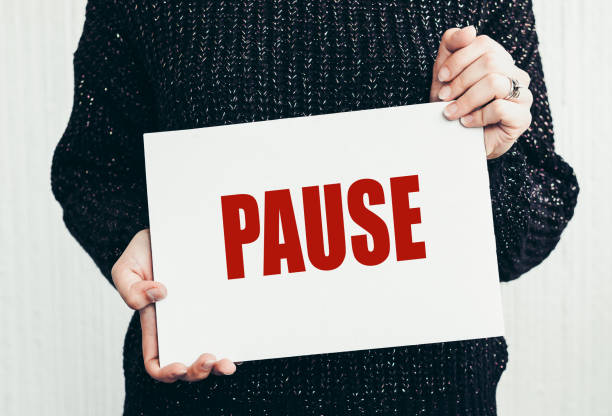 istock The word PAUSE on white paper. Break time concept 2165944652