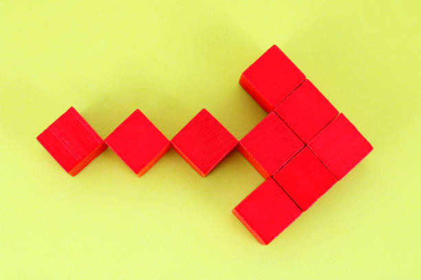 Arrow formed with wooden cubes