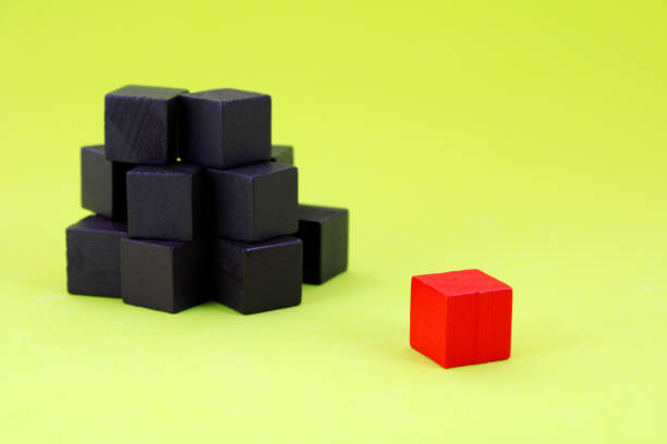 istock Wooden cube with different color that is separated from the group 2165944950