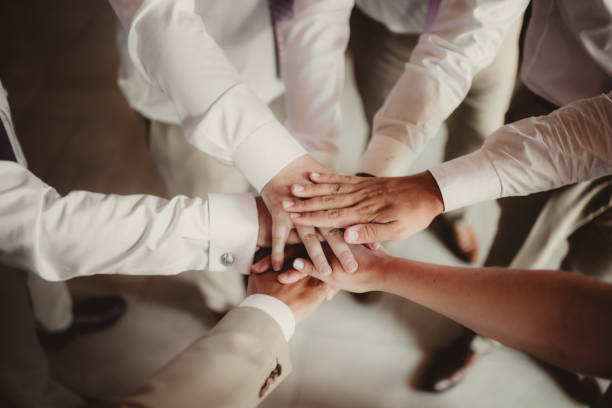 Teamwork everyone with hands in the center