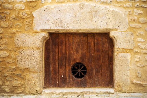 Small Wooden Door in Stone Archway