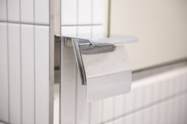 a toilet paper holder in the bathroom