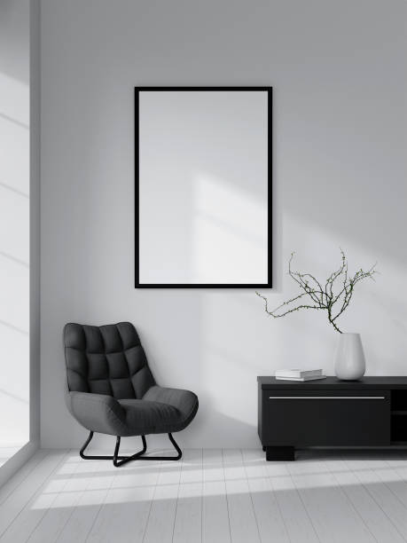 istock Modern Minimalist Interior with Black Armchair, Blank Frame, and Decorative Elements in Bright Sunlit Room 2165957217