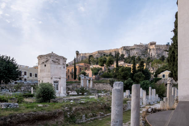 Sunrise view of the Roman Agora in Athens, Greece Sunrise view of the Roman Agora in Athens' Old Town, a significant archaeological site made of ancient ruins and open spaces, with the Acropolis towering in the background. Located north of the Acropolis and east of the Ancient Agora, the Roman Agora served as a bustling center of public life in ancient Athens, featuring a mix of marketplaces, public buildings, and temples. nike air photos stock pictures, royalty-free photos & images