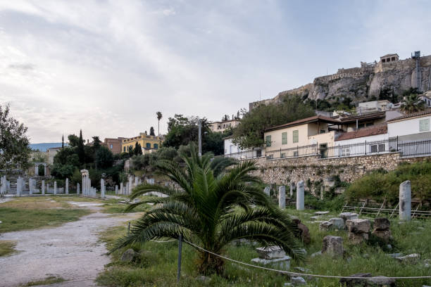 Sunrise view of the Roman Agora in Athens, Greece Sunrise view of the Roman Agora in Athens' Old Town, a significant archaeological site made of ancient ruins and open spaces, with the Acropolis towering in the background. Located north of the Acropolis and east of the Ancient Agora, the Roman Agora served as a bustling center of public life in ancient Athens, featuring a mix of marketplaces, public buildings, and temples. nike air photos stock pictures, royalty-free photos & images