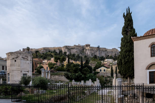 Sunrise view of the Roman Agora in Athens, Greece Sunrise view of the Roman Agora in Athens' Old Town, a significant archaeological site made of ancient ruins and open spaces, with the Acropolis towering in the background. Located north of the Acropolis and east of the Ancient Agora, the Roman Agora served as a bustling center of public life in ancient Athens, featuring a mix of marketplaces, public buildings, and temples. nike air photos stock pictures, royalty-free photos & images
