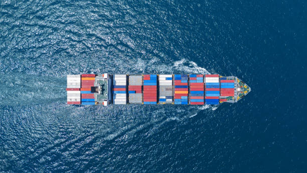 istock top view Cargo container ship carrying container and running in the ocean near international container port customs shipyard sea port concept smart logistic service. transportation logistics trading. 2165960794