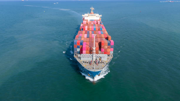 istock front view Cargo container ship carrying container and running in the ocean near international container port customs shipyard sea port concept smart logistic service. transportation logistics trading. 2165960796