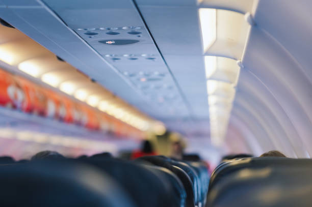 istock Wide view full passenger in seat daytime flight economy class airplane long flight from thailand to japan 2165960949