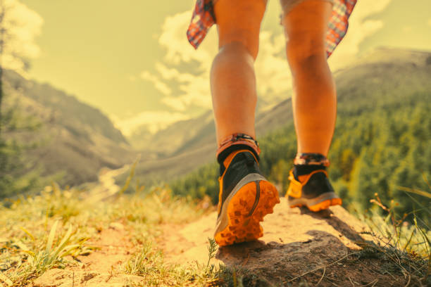 istock Womens foot steps in the mountains 2165961704