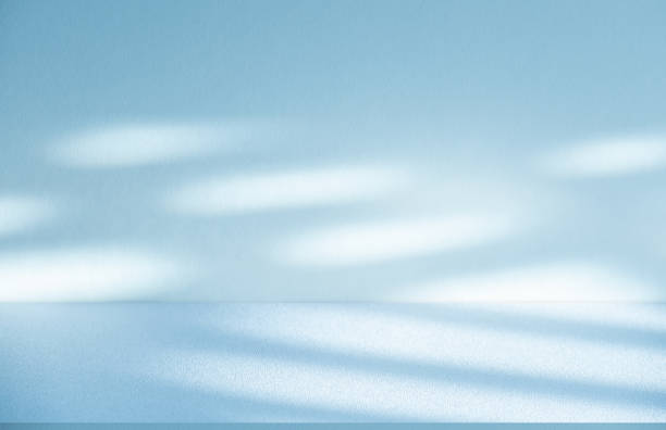 istock Studio style background wall decoration presentation uses white and blue tones. with shadows cast from a nearby window, concept creating a decorative 2165962470