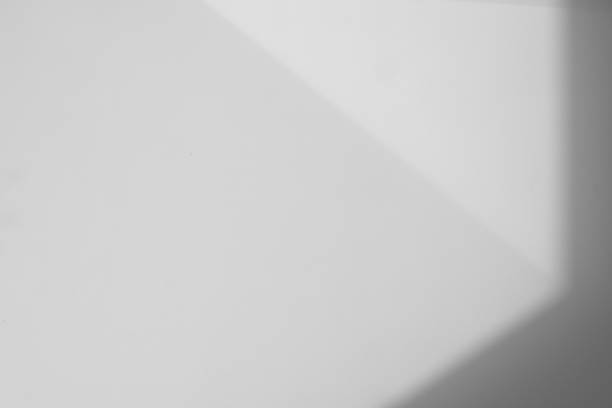 istock Studio style background wall decoration presentation uses white tones. with shadows cast from a nearby window, concept creating a decorative backdrop. 2165962482