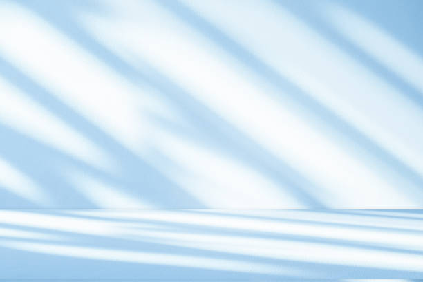 istock Studio style background wall decoration presentation uses white and blue tones. with shadows cast from a nearby window, concept creating a decorative 2165962590