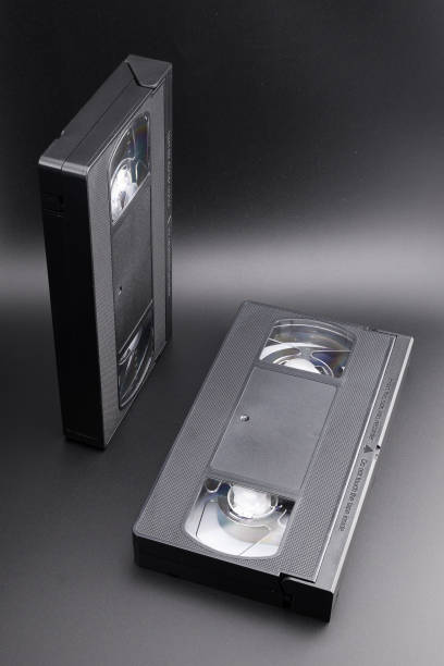 istock two VHS video cassettes on a black background 2165964191