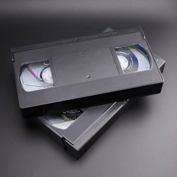 istock two VHS video cassettes on a black background 2165964192