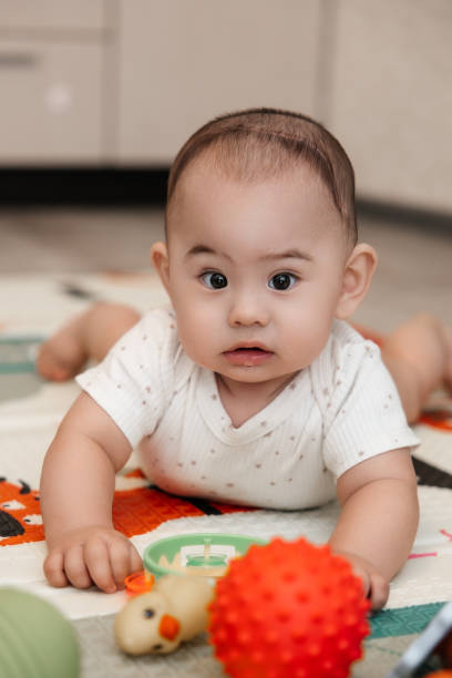 istock An infant diagnosed with trigonocephaly after the first operation with a scar on his head 2165965415