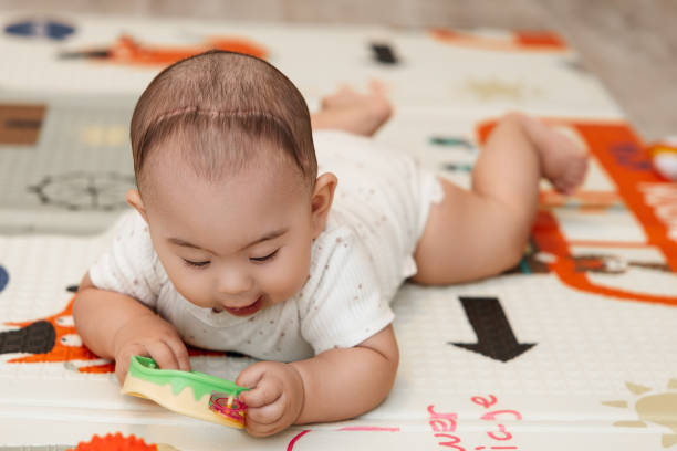 istock An infant diagnosed with trigonocephaly after the first operation with a scar on his head 2165965430