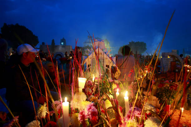 Ciudad de México, México - November 2. 2023: Decorated and illuminated tomb in the Mixquic cemetery