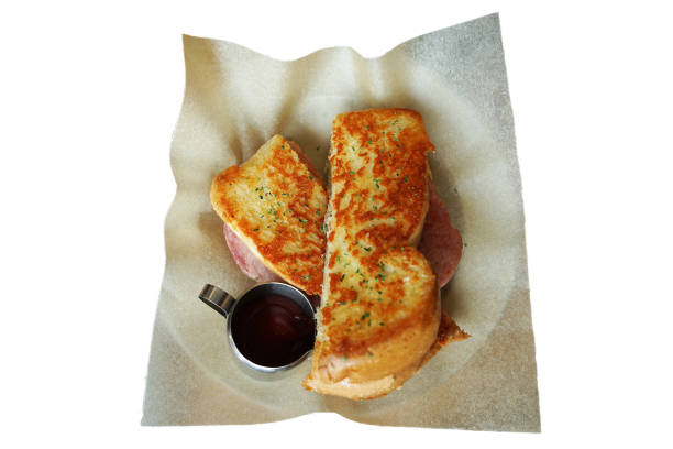 grilled bread with starwberry jam and milk on wood background