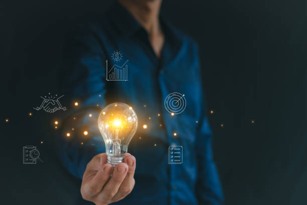 istock Man holding a light bulb, concept, business idea Collaborative growth 2165969302