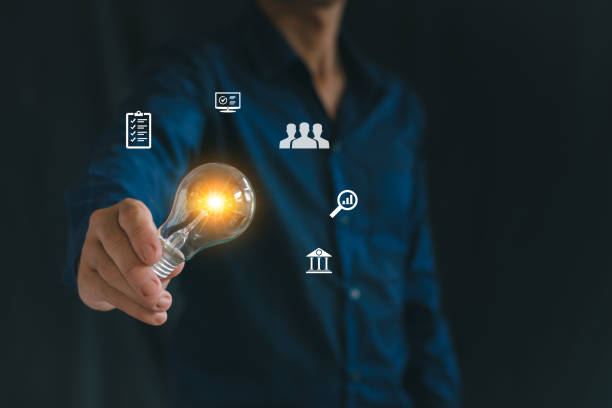 istock Men holding light bulbs, business philosophy, growth, cooperation. 2165969318