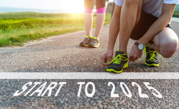 istock Start to 2025 and white starting line on asphalt road 2165969517