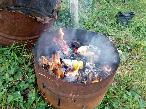 istock Burning plastic waste in a metal tube 2165970899