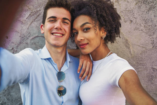 istock Interracial couple taking selfie, diversity and love concept 2165973598